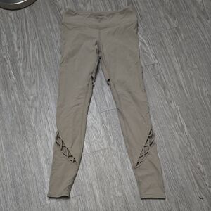 Alo Yoga Entwine Leggings in a Taupe Gravel Tan Criss Cross S